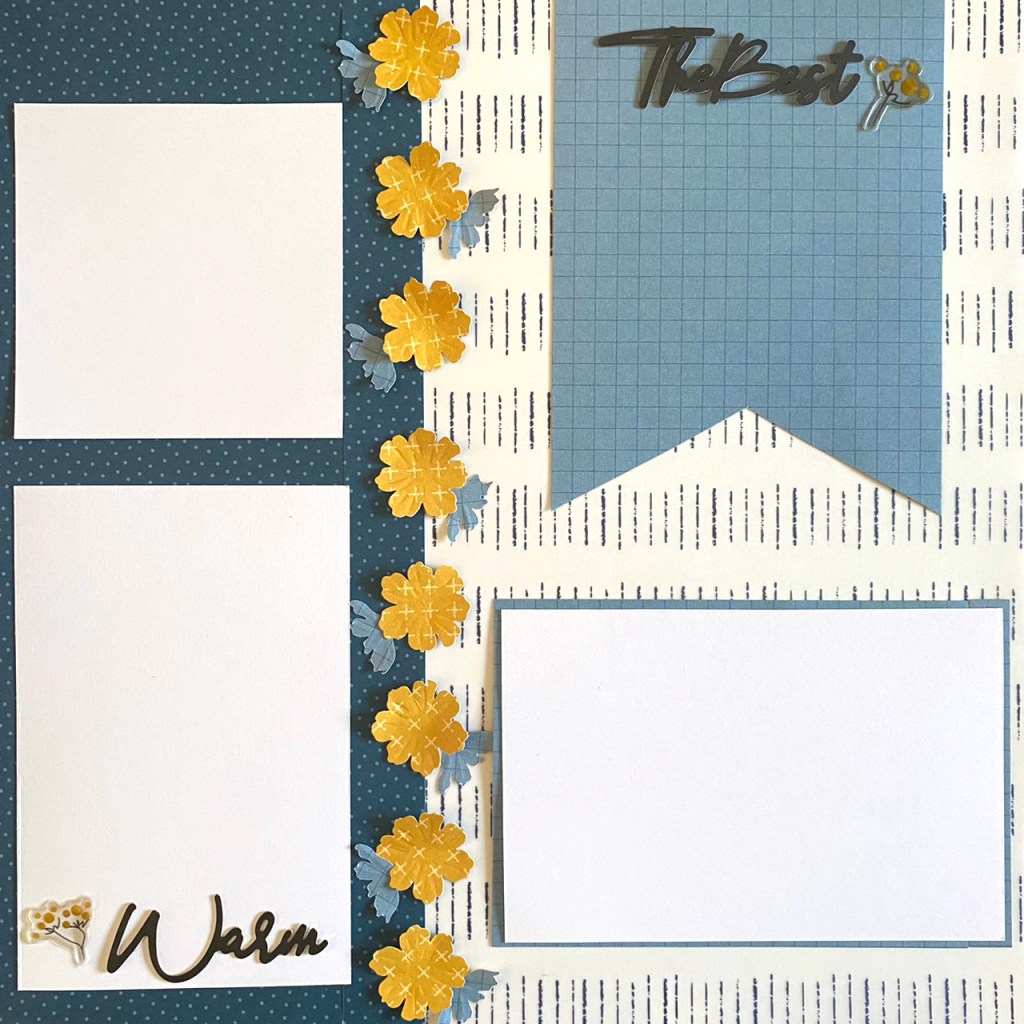 One page scrapbook layout with blue paper, three photos mats, a ribbon and flower embellishments.