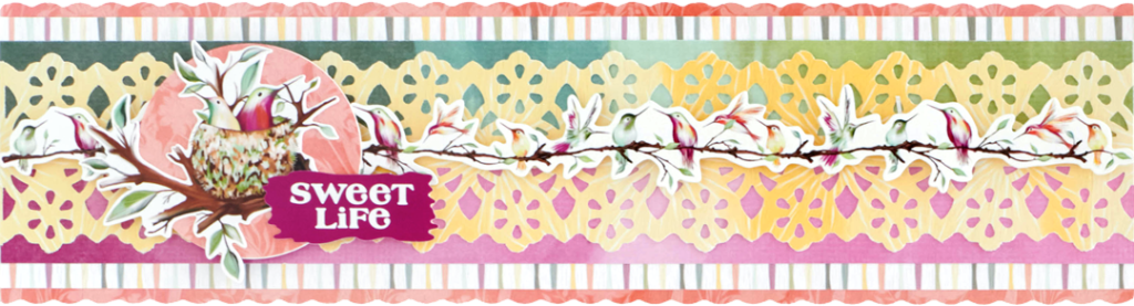 Spring scrapbooking border with hummingbird stickers and floral-patterned cutouts.