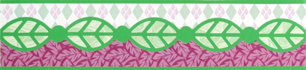 Horizontal scrapbook border with green and purple paper and a leaf-shaped decorative border.