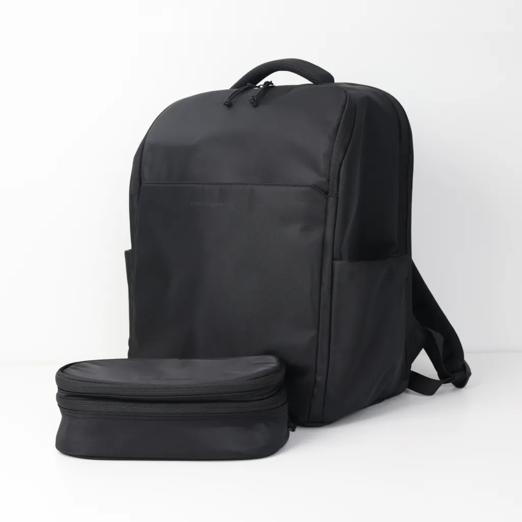 A sleek black backpack with a minimalist design, accompanied by a detachable black zippered pouch.