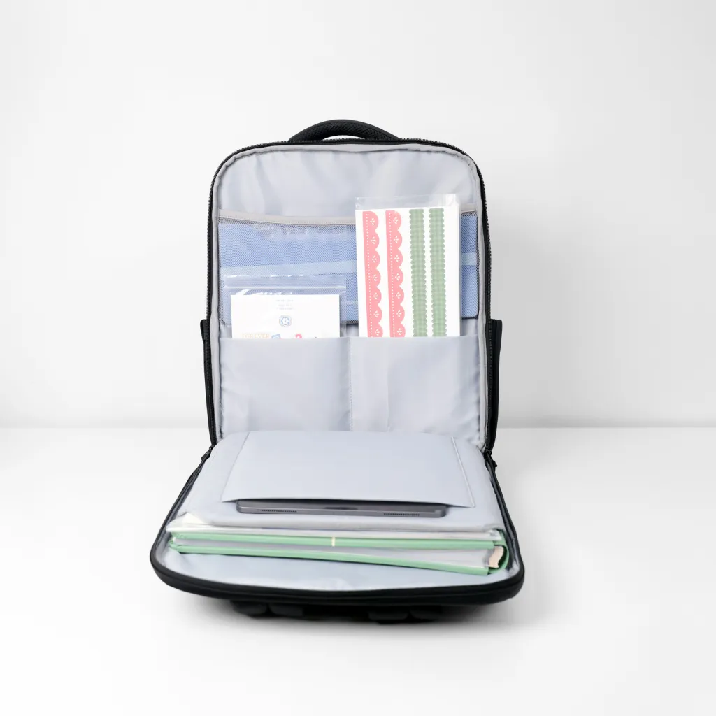 Open backpack showing various organized stationery items, including colored papers, stickers, and folders.